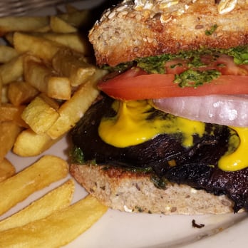 Trufa Restaurant - Vegan portobello burger on multi grain bread with red onions, pesto, greens and I added mustard. Normally comes with avocado - New American Near Me - New York, New York Trufa Restaurant - Vegan portobello burger on multi grain bread with red onions, pesto, greens and I added mustard. Normally comes with avocado - New American Near Me - New York, New York
