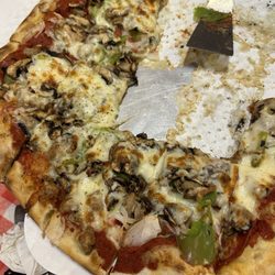 Scott's Pizza Kitchen - Large supreme pizza. The rest goes home with us for breakfast.