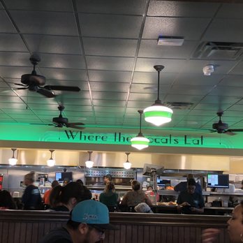 Metro Diner - Interior. Sign says, "Where the locals eat." - American Near Me - Casselberry, Florida Metro Diner - Interior. Sign says, "Where the locals eat." - American Near Me - Casselberry, Florida
