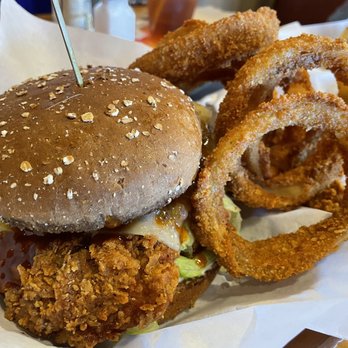 Islands Restaurant - Huli Huli Crisp (Hand breaded fried chicken breast, fresh pineapple, Swiss, lettuce, mayo, & Island huli huli sauce) with onion rings - Burgers Near Me - Carlsbad, California Islands Restaurant - Huli Huli Crisp (Hand breaded fried chicken breast, fresh pineapple, Swiss, lettuce, mayo, & Island huli huli sauce) with onion rings - Burgers Near Me - Carlsbad, California