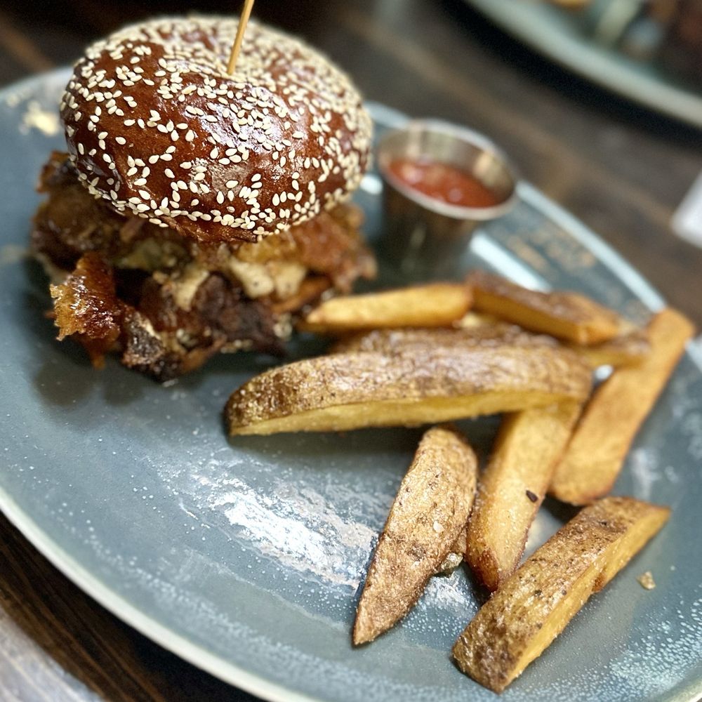 Bosscat Kitchen & Libations - Shaved Pork Chop Sandwich - Bars Near Me - Orange, California Bosscat Kitchen & Libations - Shaved Pork Chop Sandwich - Bars Near Me - Orange, California