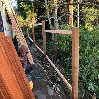 Optima Fence and Deck - Setting the posts in cement. The guys kept showing me the level bubbles on all the posts and beams. - Fences & Gates Near Me - Mercer Island, Washington Optima Fence and Deck - Setting the posts in cement. The guys kept showing me the level bubbles on all the posts and beams. - Fences & Gates Near Me - Mercer Island, Washington