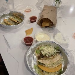 Beef tacos and small cheese dip with jalapeños