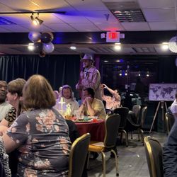 Riga-Tony’s Murder Mystery Dinner Show - The Detective strolls through the audience with funny improv notes about people at the tables