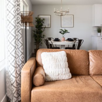 GrayHouse Properties - a living room and dining room - Interior Design Near Me GrayHouse Properties - a living room and dining room - Interior Design Near Me
