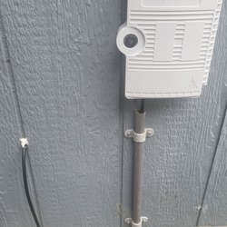 Mertonet Internet - On the left is Spectrum installers, the right with the box and protected pipe is Metronet