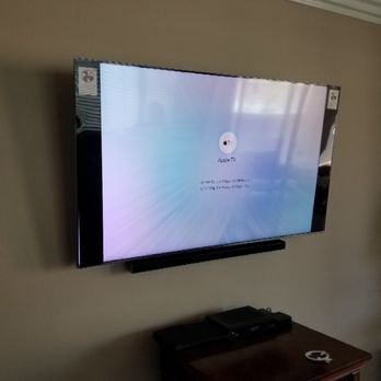 Precision Network Solutions - 65" Samsung 4K Ultra HD TV Mounted with all wiring concealed, connected to an Apple 4K TV device. - Home Automation Near Me - Los Angeles, California Precision Network Solutions - 65" Samsung 4K Ultra HD TV Mounted with all wiring concealed, connected to an Apple 4K TV device. - Home Automation Near Me - Los Angeles, California