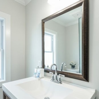 Samuels Construction - a bathroom with a sink and mirror - General Contractors Near Me - Trenton, New Jersey Samuels Construction - a bathroom with a sink and mirror - General Contractors Near Me - Trenton, New Jersey
