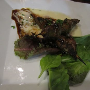 Global Grill - Peppercorn Beef Brochettes,Smoked Gouda Cheese Sauce - Global Grille in Pensacola, FL - New American Near Me - Pensacola, Florida
