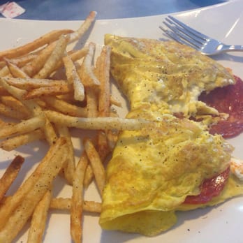 Flying With Jerome - Three egg omelette w/ Chorizo, cheese, and a side of french fries. - Breakfast & Brunch Near Me - Clearwater, Florida Flying With Jerome - Three egg omelette w/ Chorizo, cheese, and a side of french fries. - Breakfast & Brunch Near Me - Clearwater, Florida