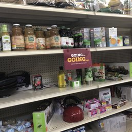 a grocery store shelf with items for sale