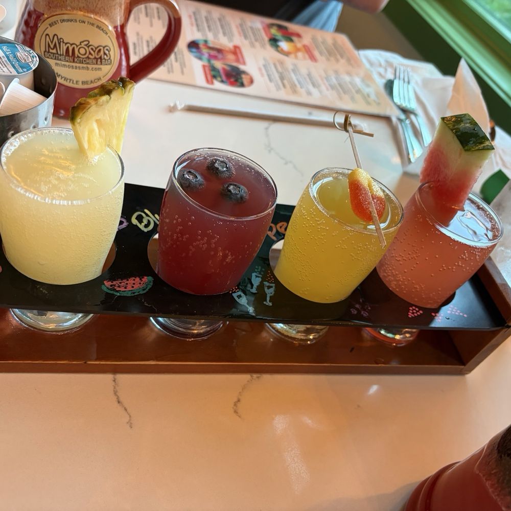 Mimosas - Seasonal Mimosa Flight: pina colada, blueberry,peach & watermelon - Breakfast & Brunch Near Me - Myrtle Beach, South Carolina Mimosas - Seasonal Mimosa Flight: pina colada, blueberry,peach & watermelon - Breakfast & Brunch Near Me - Myrtle Beach, South Carolina