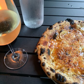 Swyft Restaurant - Yellow Jacket pizza paired with glass of Petit Chablis - Bars Near Me - Kent, Connecticut