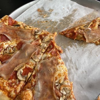 Vesuvio Pizzeria - a half eaten pizza - Pizza Near Me - Coquitlam, British Columbia