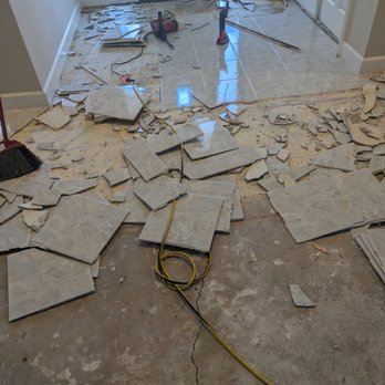 Floor Coverings International Jacksonville East - Tearing out tile in foyer - Flooring Near Me - Jacksonville, Florida Floor Coverings International Jacksonville East - Tearing out tile in foyer - Flooring Near Me - Jacksonville, Florida