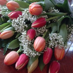 The bouquet I had the woman at the counter put together, of red and orange tulips and baby's breath.