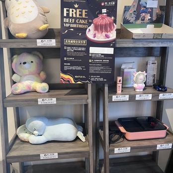 Liuyishou Hotpot - Cute decor and ad for free beef cake - Hot Pot Near Me - Bellevue, Washington