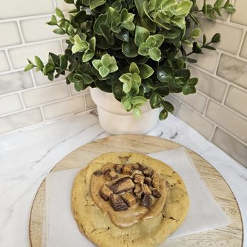 The Wandering Bean - a pastry on a cutting board next to a potted plant - Coffee & Tea Near Me - Hillsboro, Missouri The Wandering Bean - a pastry on a cutting board next to a potted plant - Coffee & Tea Near Me - Hillsboro, Missouri