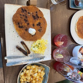 First Watch - Chocolate chip pancake, turkey sausage, scrambled eggs, and side of potatoes - Breakfast & Brunch Near Me - Grand Prairie, Texas First Watch - Chocolate chip pancake, turkey sausage, scrambled eggs, and side of potatoes - Breakfast & Brunch Near Me - Grand Prairie, Texas