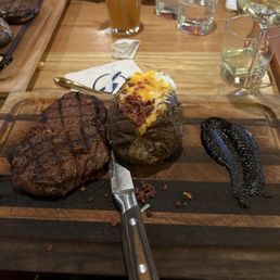 12oz rib eye and loaded bake potatoe 12oz rib eye and loaded bake potatoe