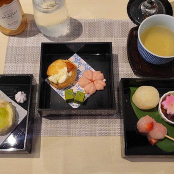 Cha-An - final round of dessert - sakura cookie, orange custard puff, anmitsu, strawberry dango, roll cake, yuzu daifuku along with sparkling wine - Japanese Near Me - New York, New York