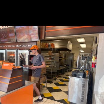 Little Caesars Pizza - a man in a fast food restaurant - Pizza Near Me - O Fallon, Missouri