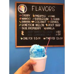 Tiki Shack - Bubble gum shave ice with menu in the background.