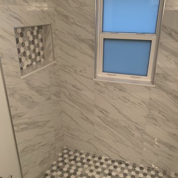 Angel Tile and Marble Installation - a shower with a window - Flooring Near Me Angel Tile and Marble Installation - a shower with a window - Flooring Near Me