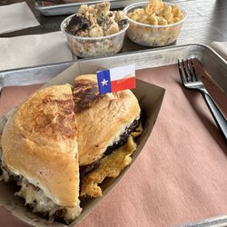 1/2 turkey Reuben, 1/2 Bexar burger. Warm potato salad and mac n cheese. They cut the sandwiches when we told them we planned on sharing.