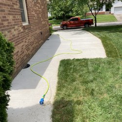 Big Blue Concrete Solutions - New driveway with an extended walkway.