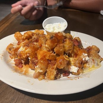 Mackey's Steakhouse & Pub - (Half eaten) Loaded tots - Steakhouses Near Me - Ontario, Oregon Mackey's Steakhouse & Pub - (Half eaten) Loaded tots - Steakhouses Near Me - Ontario, Oregon
