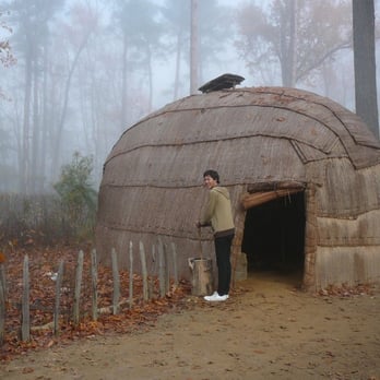 Jamestown Settlement - Grinding corn the Powhatan way - Museums Near Me - Williamsburg, Virginia