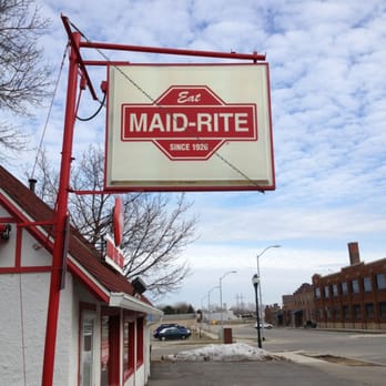 Maid-Rite - a red and white sign hanging from the side of a building - Diners Near Me - Cedar Falls, Iowa