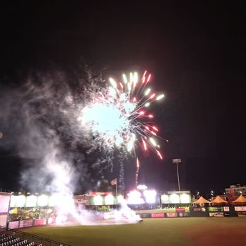 Wellspan Park - Fireworks light up the night sky over a baseball stadium with spectators in the stands, with smoke and bright colors visible. - Stadiums & Arenas Near Me - York, Pennsylvania
