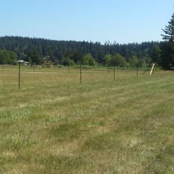 J & A fencing - 4' field fence, 2 strand barb wire with round wood posts, t-posts, multiple farm gates & round wood kickers.