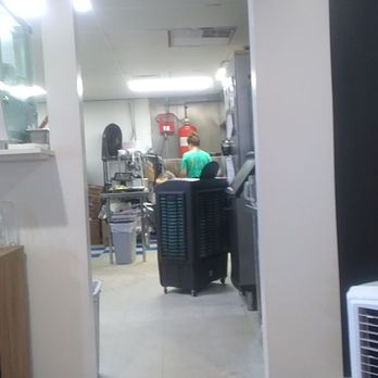 Upscale Rio - I can see in the kitchen, pretty neat and clean.  They are cooking for 12 to 15 tables. - Burgers Near Me - Rio Rancho, New Mexico