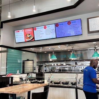 Bolay - a man working at a restaurant counter - New American Near Me - Pembroke Pines, Florida