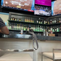 Who’s on First - Who's on first bar with lots of tvs and seating but no backs on those chairs!