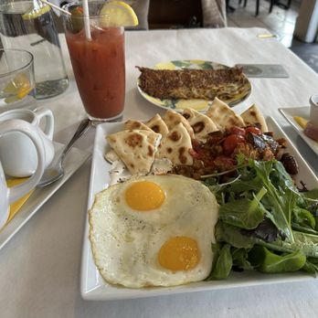 The Lemon Tree - Turkish eggs with hash browns on the side. Homemade hot sauces. Coffee and Bloody Mary. - Cocktail Bars Near Me - Bend, Oregon