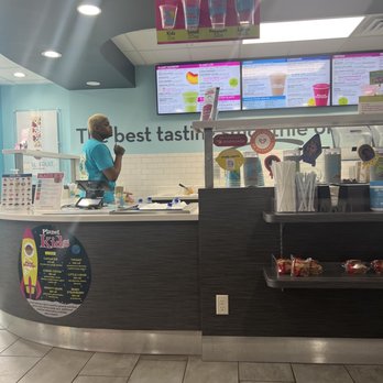 Planet Smoothie - a woman ordering at the counter - Juice Bars & Smoothies Near Me - Glendale, Wisconsin