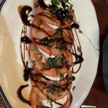 Amore da Roma - Heirloom tomatoes with buffalo mozzarella and balsamic dressing with basil - Italian Near Me - Detroit, Michigan Amore da Roma - Heirloom tomatoes with buffalo mozzarella and balsamic dressing with basil - Italian Near Me - Detroit, Michigan