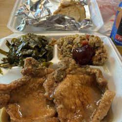 Papa & Mama Chat's - Smothered pork chops, dressing, greens, cornbread, cranberry sauce.