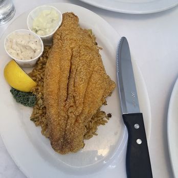 Christie's Seafood & Steaks - Fried Catfish with dirty rice - Seafood Near Me - Houston, Texas Christie's Seafood & Steaks - Fried Catfish with dirty rice - Seafood Near Me - Houston, Texas