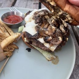 Classic burger I added mushrooms and cheese with regular fries. Sooo good Delicious ! Classic burger I added mushrooms and cheese with regular fries. Sooo good Delicious !
