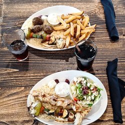 Athenian Grill - Above is the falalel platter and below is the chicken souvlaki platter (mine). Soft drinks were also chosen. My food was very tasty.