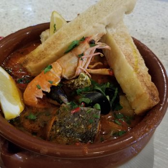 Mourne Seafood Bar - Seafood casserole with mussels, fish, an oyster and a langustino in a tomato bisque. - Seafood Near Me - Belfast, BFS Mourne Seafood Bar - Seafood casserole with mussels, fish, an oyster and a langustino in a tomato bisque. - Seafood Near Me - Belfast, BFS