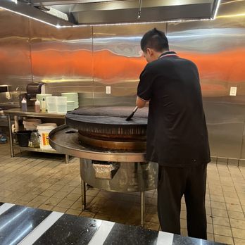 Gobi Mongolian Bbq - Cleaning of the grill - Mongolian Near Me - Santa Cruz, California