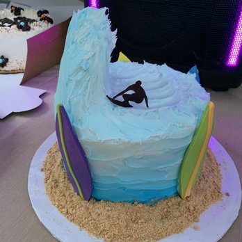 Nells Cakes - Graham cracker crumbs to mimick sand. I also specifically requested this gradient on the side and an active wave with a surfer riding it. - Desserts Near Me - Stoneham, Massachusetts