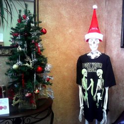 Carrollton Chiropractic and Massage - Our skeleton likes to dress up for Christmas. Not to worry. He is not Klan.