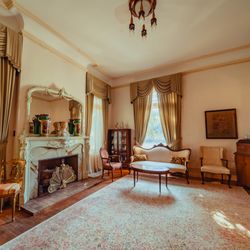 Alexander Mansion - The French Room is a delightful place to host guests at your special event. The marble fireplace is an elegant backdrop for any occasion.